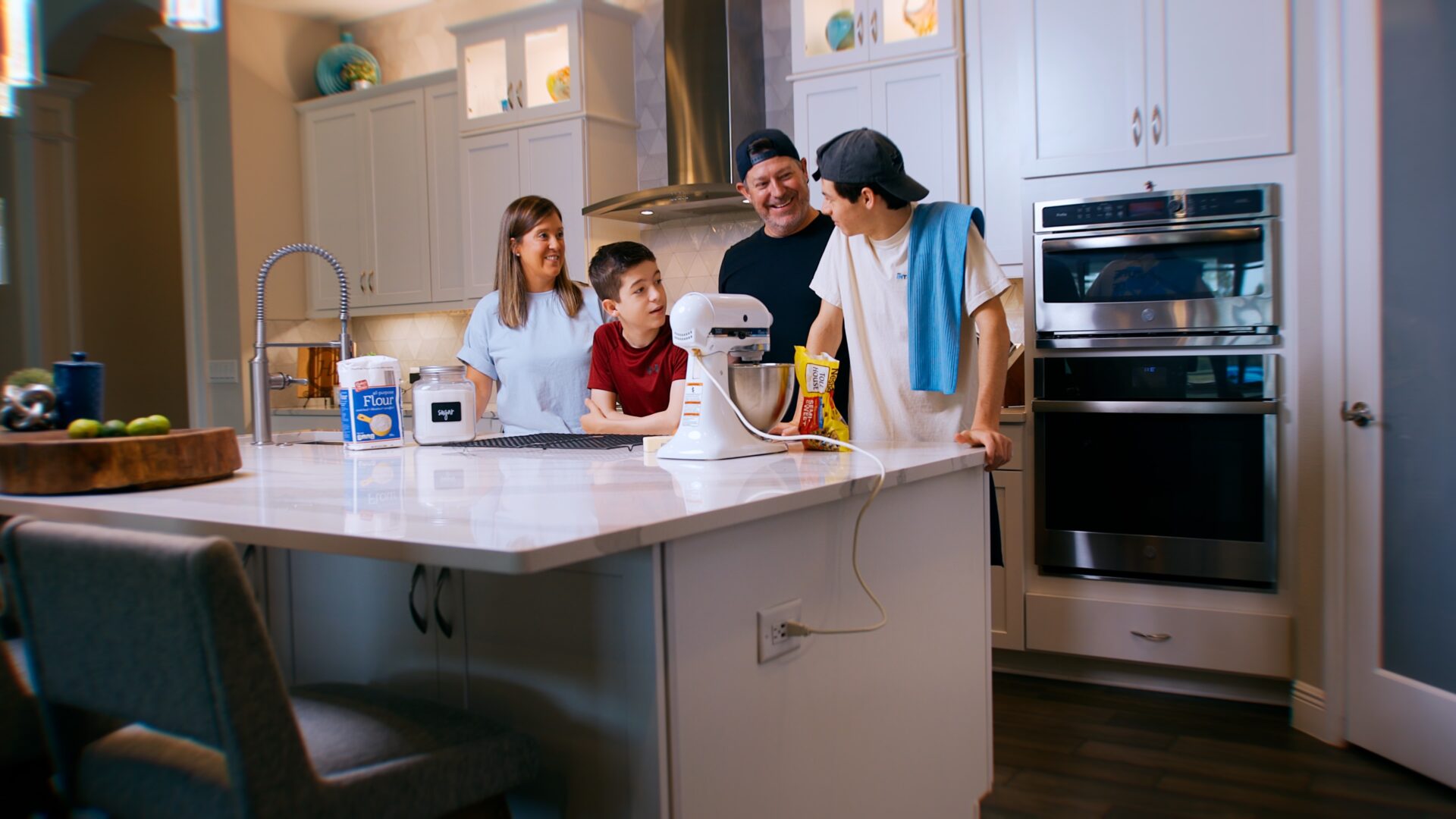 A mother and her children together in the kitchen instead of sorting laundry